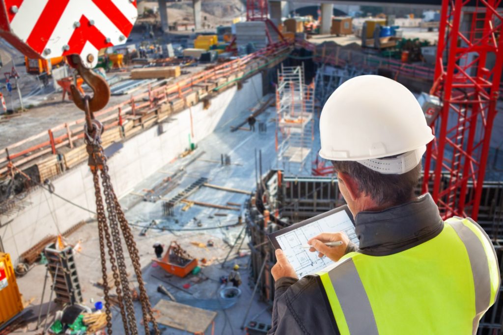 engineer architect Foreman on construction site with tablet computer