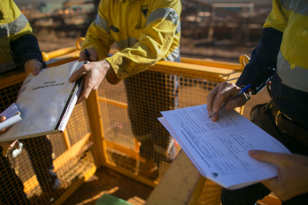 Health and Safety Awareness (HSA) Trained supervisor safety auditor competent reviewing document issued sign approvals of working at height permit JSA risk assessment on site prior to performing high risk work mining construction site